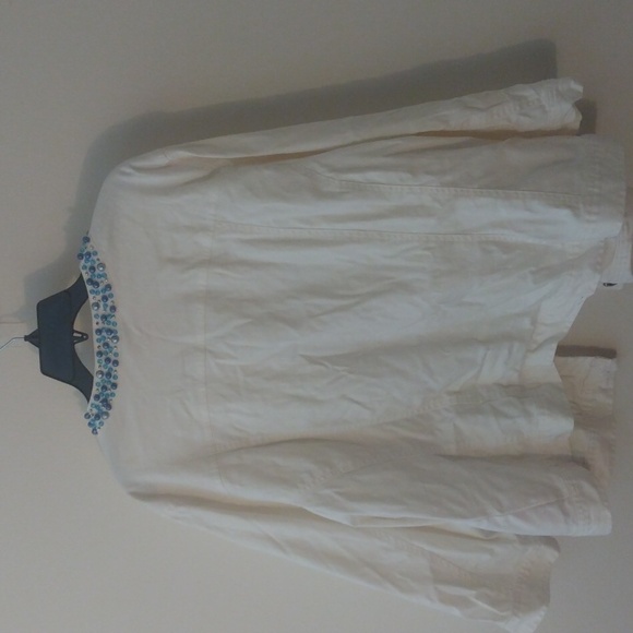 White jean jacket adorned with blue rhinestone like pieces. - Picture 5 of 6